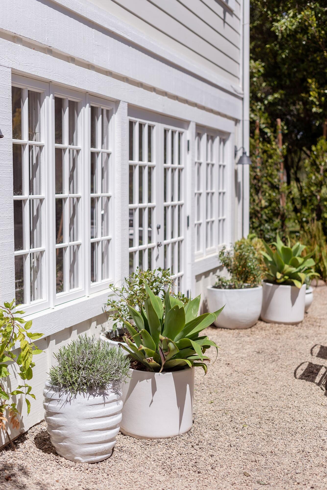 1355 Danielson Road Montecito, CA 93108 - Photo 13 of 25 a white vase with white and yellow flowers