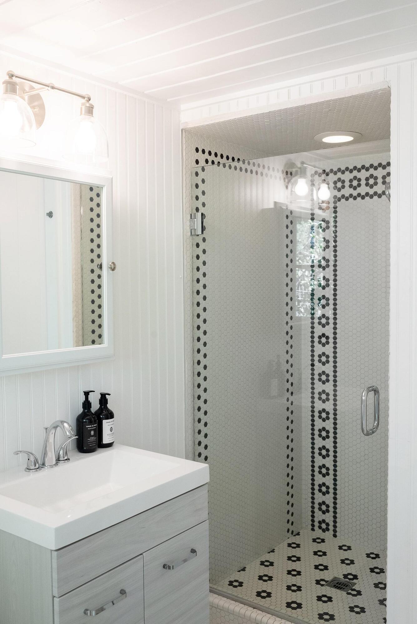 1355 Danielson Road Montecito, CA 93108 - Photo 10 of 25 a bathroom with a sink a mirror and shower