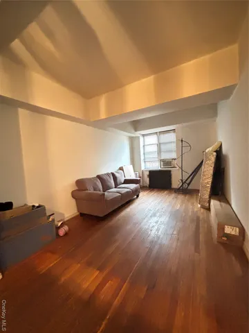 a view of a living room with hardwood floor