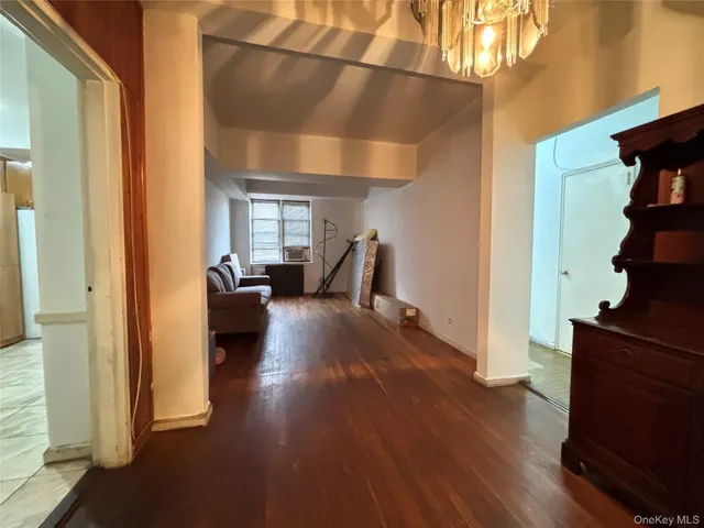 a kitchen with stainless steel appliances kitchen island granite countertop a refrigerator and a stove