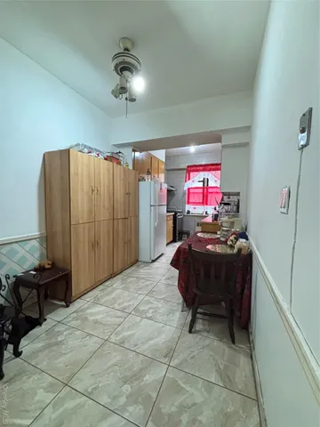 a kitchen with a stove and a refrigerator