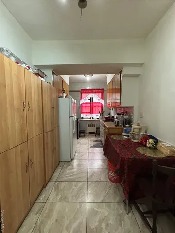 a kitchen with a sink and a stove top oven