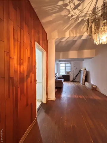 a view of a livingroom with wooden floor