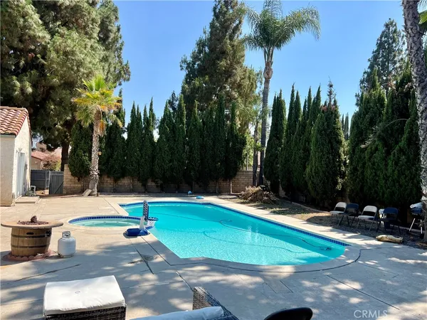a view of a swimming pool with a patio