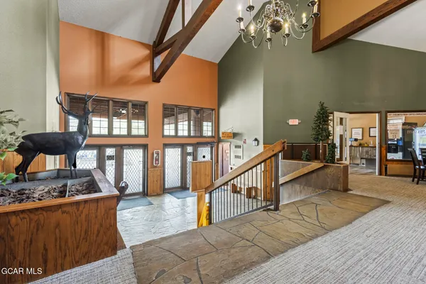a kitchen with stainless steel appliances granite countertop a stove and a refrigerator