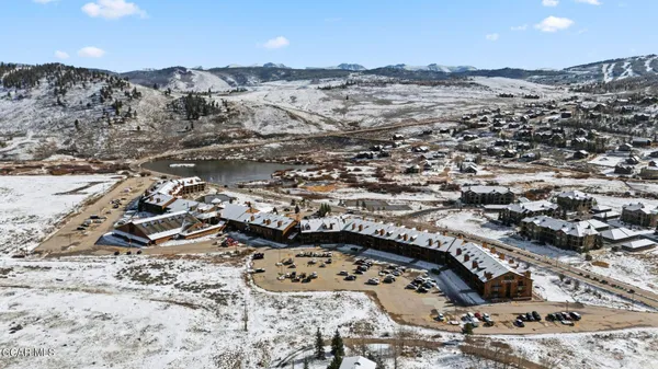 an aerial view of residential building and ocean view