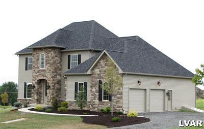 212 East Dell Road Bath, PA 18014 - Photo 1 of 24 a front view of a house with a garden