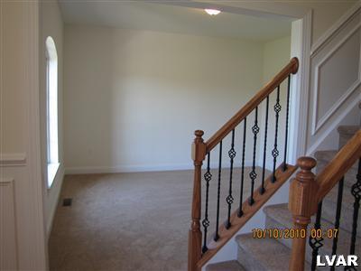 212 East Dell Road Bath, PA 18014 - Photo 11 of 24 a view of staircase with lots of frames on wall