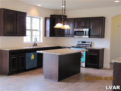 212 East Dell Road Bath, PA 18014 - Photo 3 of 24 a kitchen with a sink stove and microwave