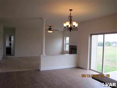212 East Dell Road Bath, PA 18014 - Photo 8 of 24 an empty room with windows and fireplace