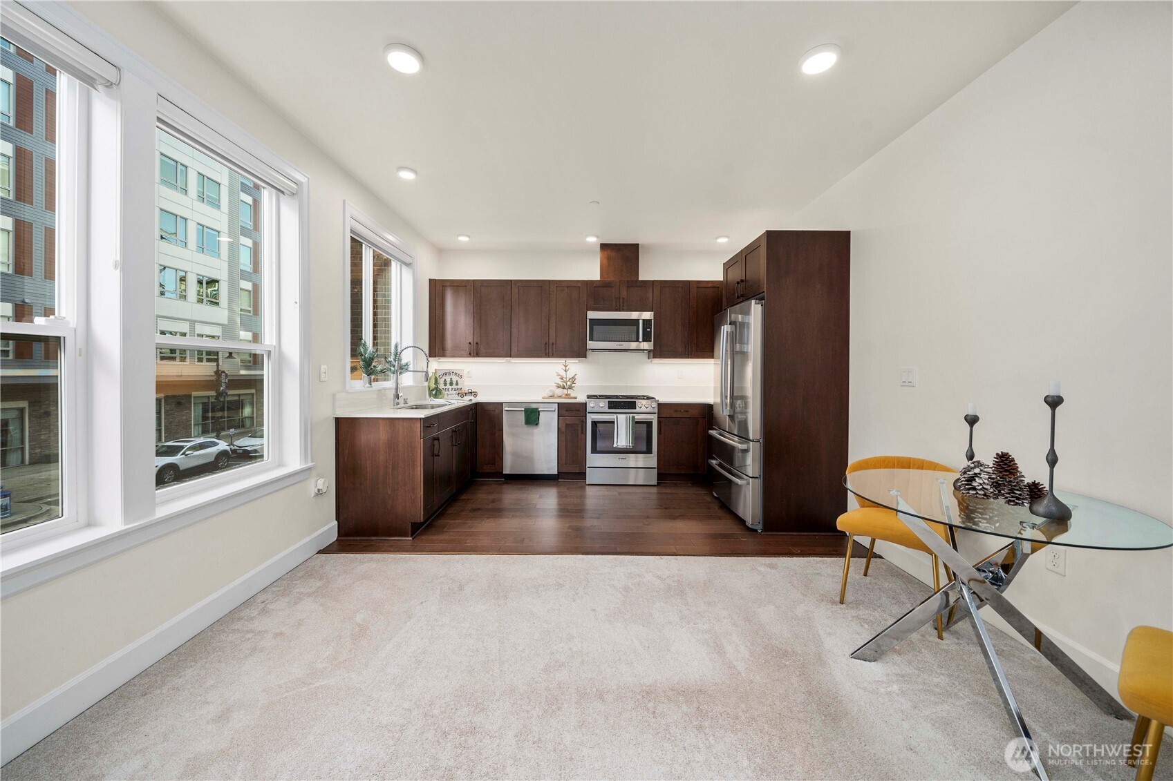 4961 Main Street, Unit 314 Tacoma, WA 98407 - Photo 12 of 40 a living room with stainless steel appliances furniture a rug and a window