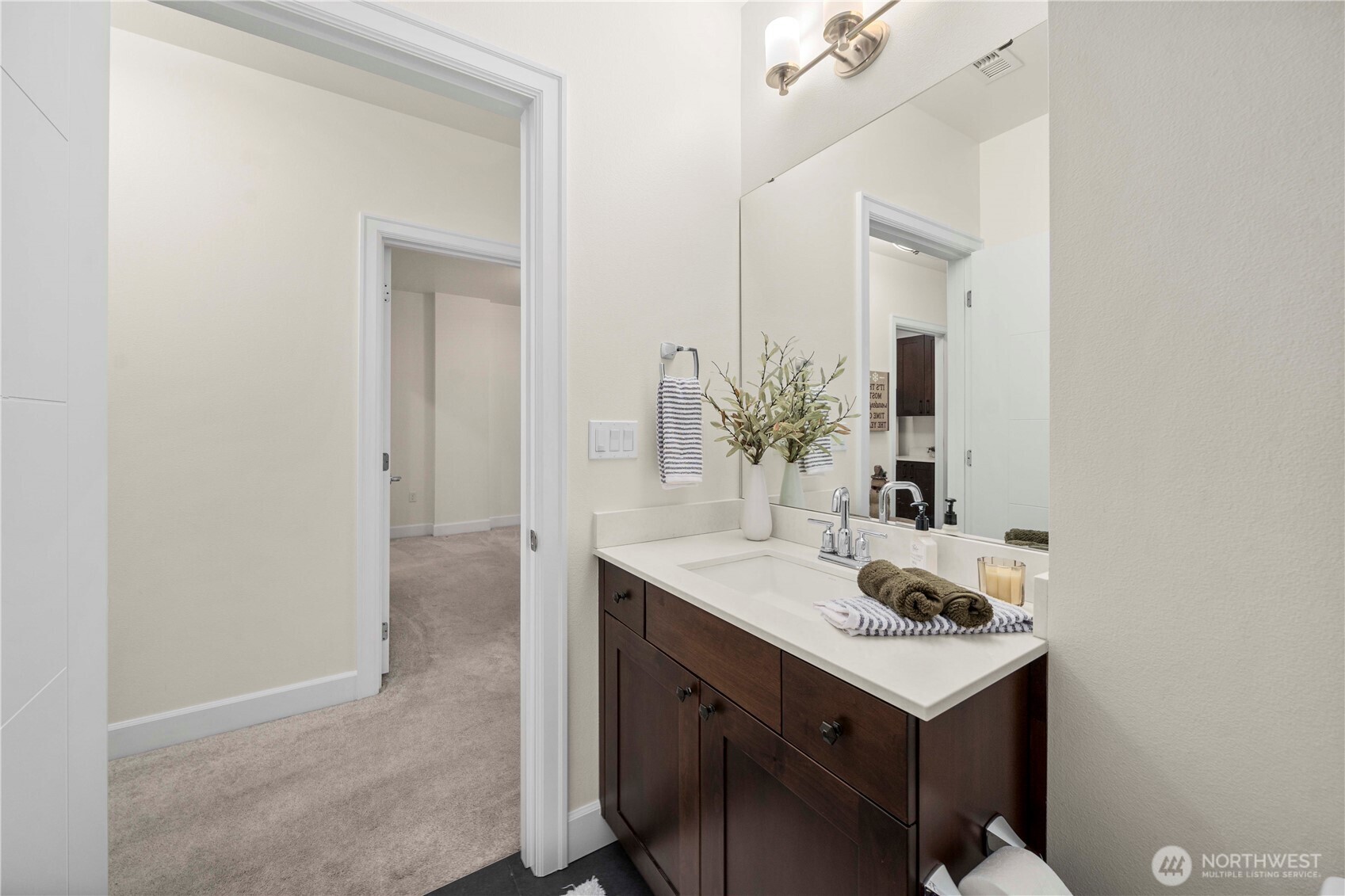 4961 Main Street, Unit 314 Tacoma, WA 98407 - Photo 19 of 40 a bathroom with a sink and a mirror