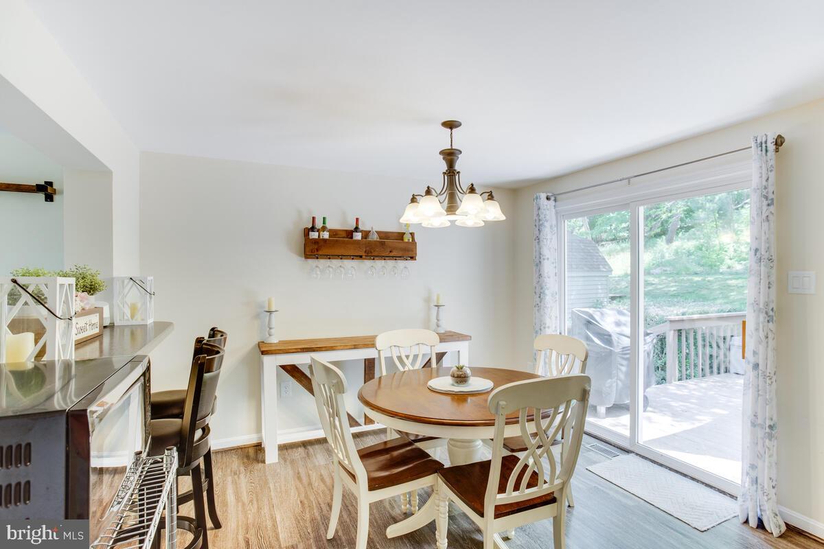 1260 Coster Road Lusby, MD 20657 - Photo 10 of 46 a view of a dining room with furniture window and outside view