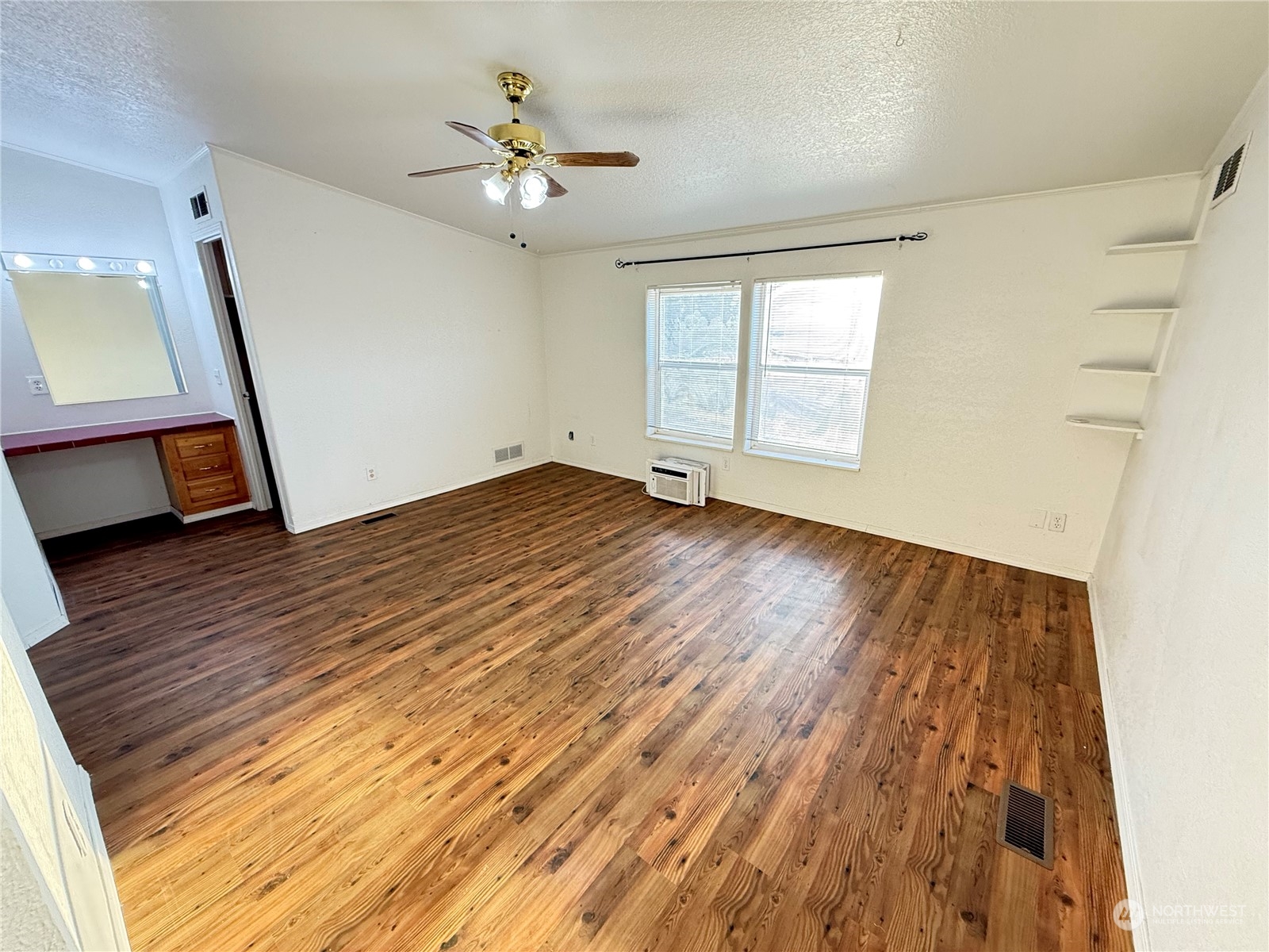402 Poulsen Road Dayton, WA 99328 - Photo 10 of 34 wooden floor in an empty room with a window