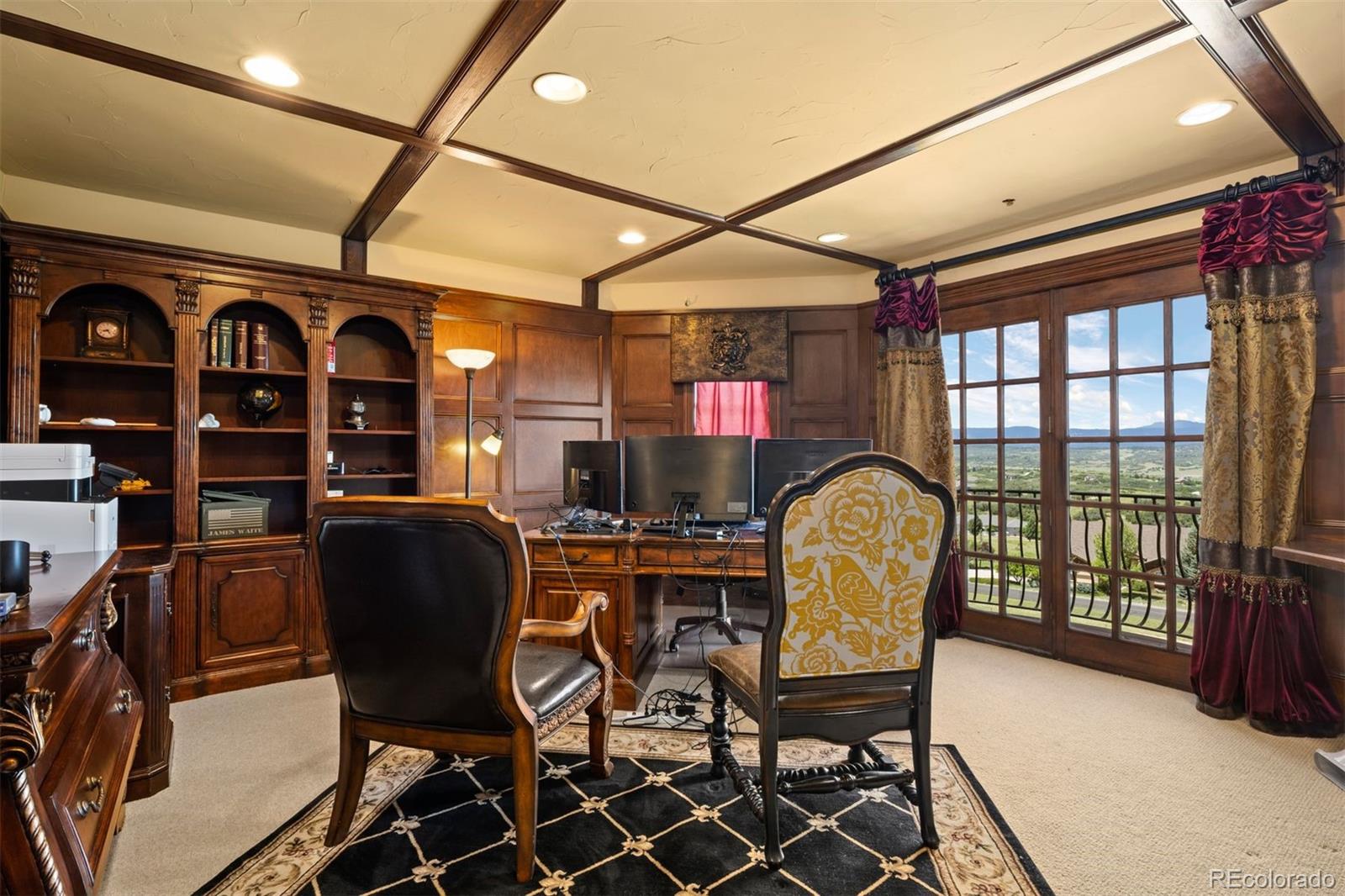 3440 Medallion Road Castle Rock, CO 80104 - Photo 20 of 50 a view of a dining room with furniture and chandelier