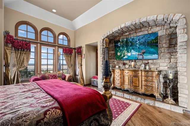 a bed sitting in a bedroom next to a window