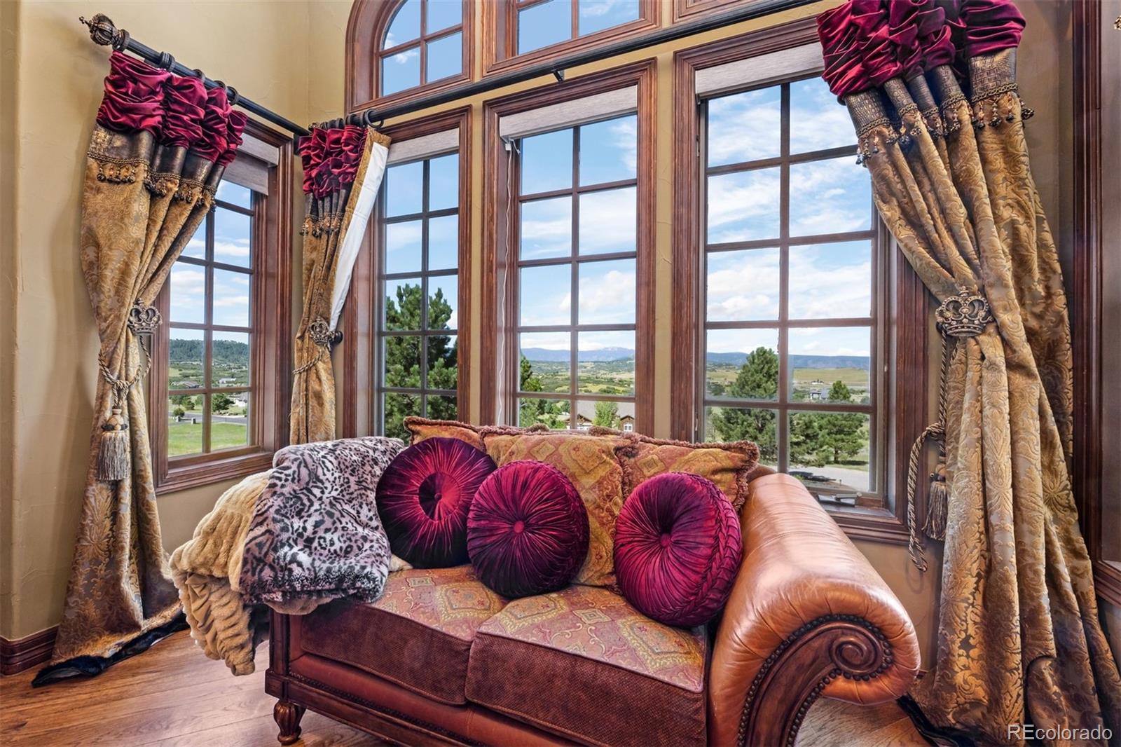 3440 Medallion Road Castle Rock, CO 80104 - Photo 33 of 50 a living room with furniture and a large window