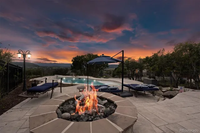 a view of a backyard with sitting area