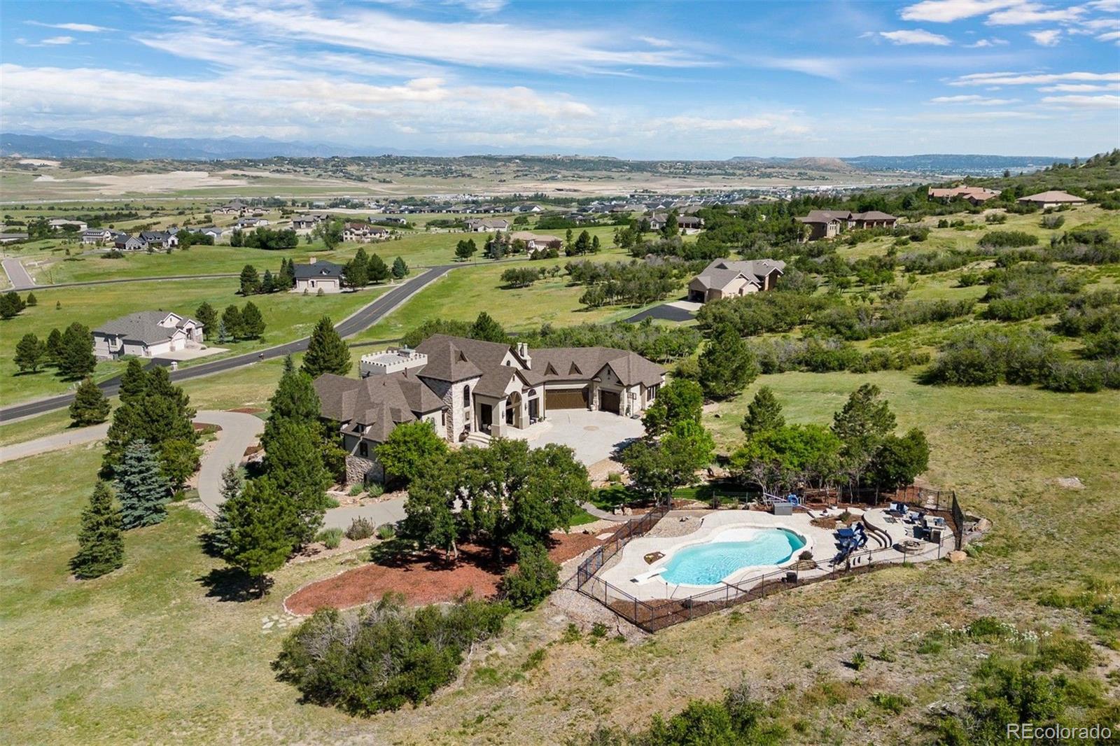 3440 Medallion Road Castle Rock, CO 80104 - Photo 7 of 50 an aerial view of a city with lots of residential buildings ocean and mountain view in back