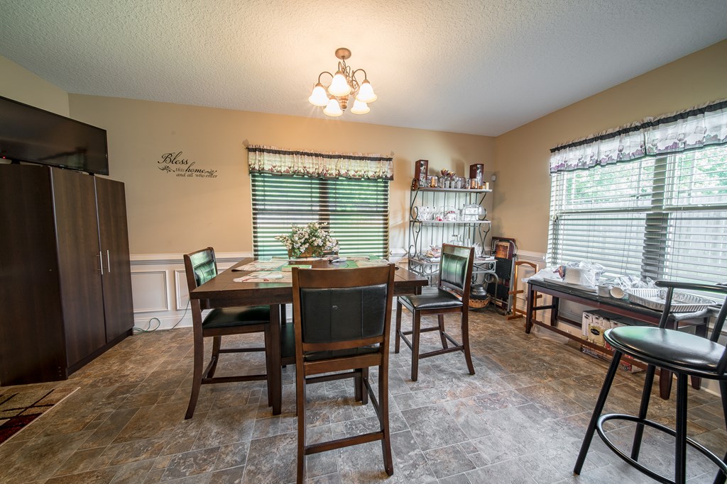 18 Summershade Court Fort Mitchell, AL 36856 - Photo 16 of 37 a view of a dining room with furniture window and outside view