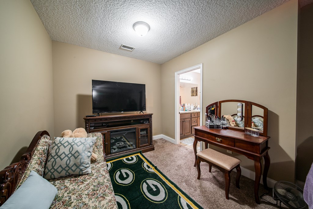18 Summershade Court Fort Mitchell, AL 36856 - Photo 22 of 37 a living room with furniture and a flat screen tv