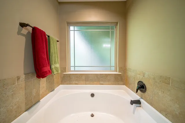 a bathroom with a bath tub