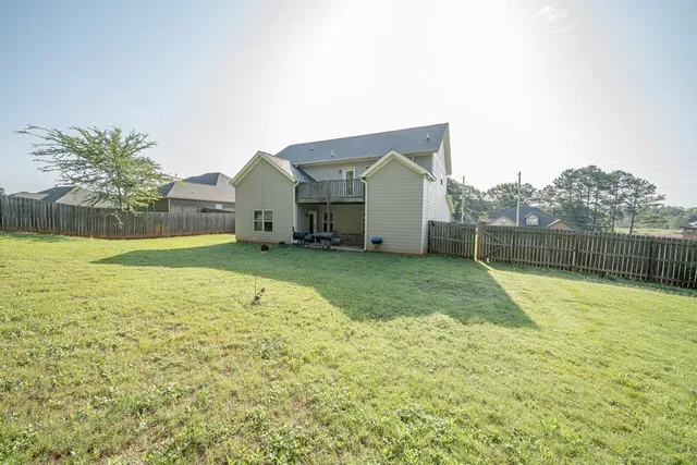 a view of a house with a swimming pool