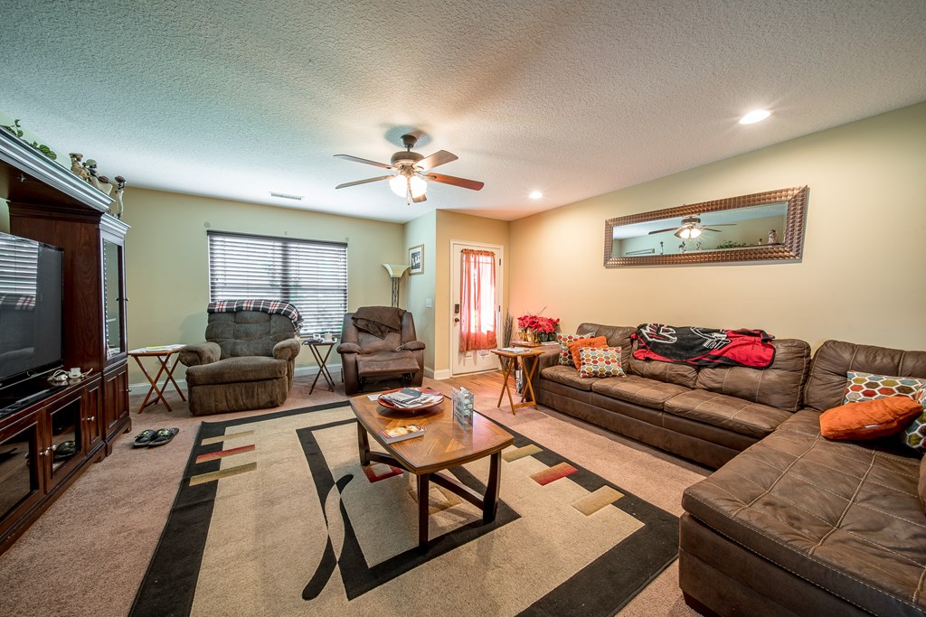 18 Summershade Court Fort Mitchell, AL 36856 - Photo 8 of 37 a living room with furniture and a flat screen tv