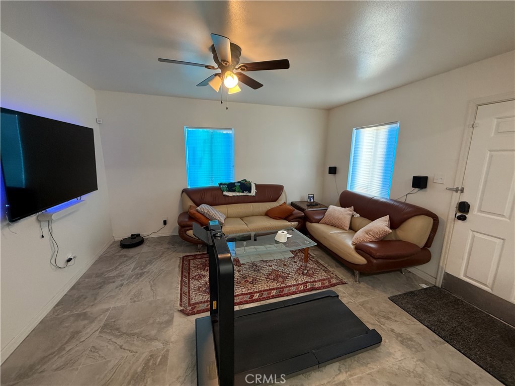 290 North 3rd Street Blythe, CA 92225 - Photo 3 of 6 a living room with furniture and a flat screen tv