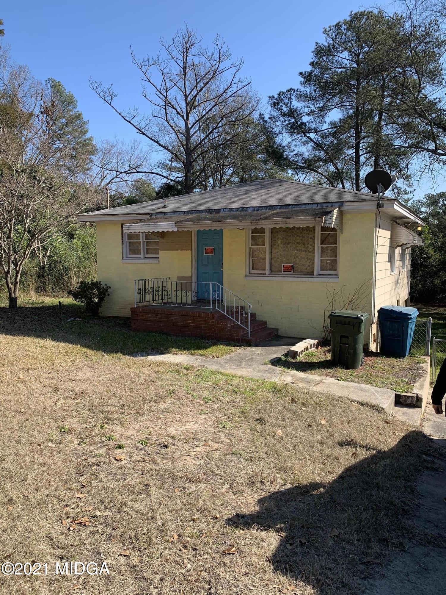 a house with trees in the background