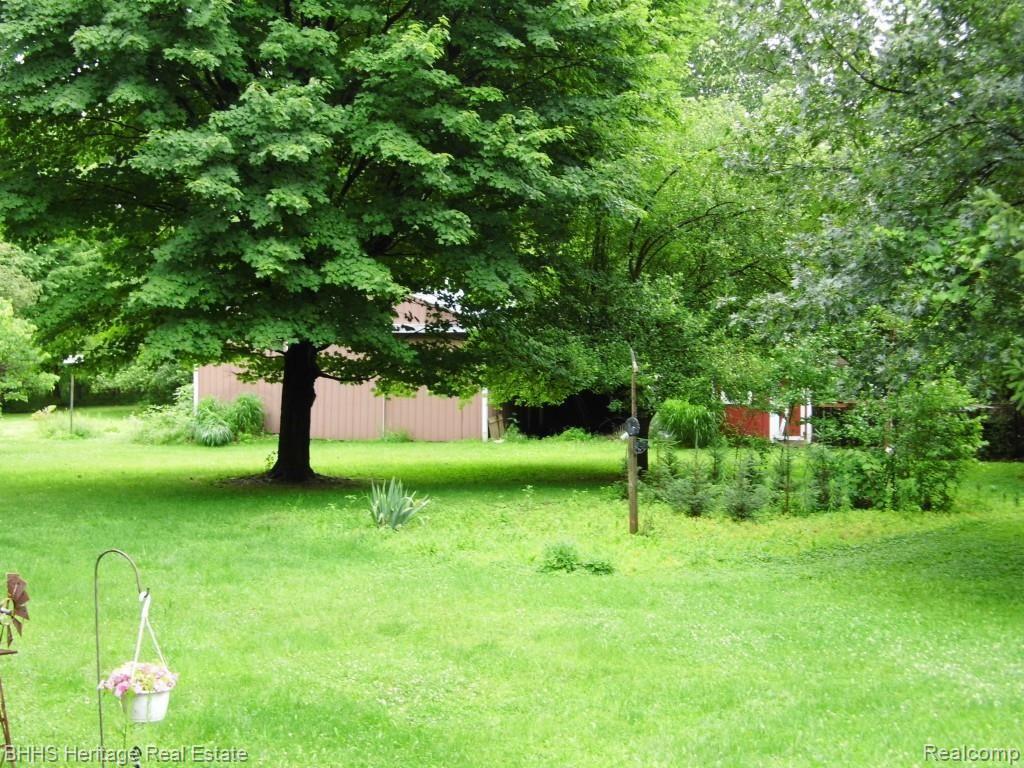 6950 West Sober Road Fowlerville, MI 48836 - Photo 11 of 32 Back yard and garden area
