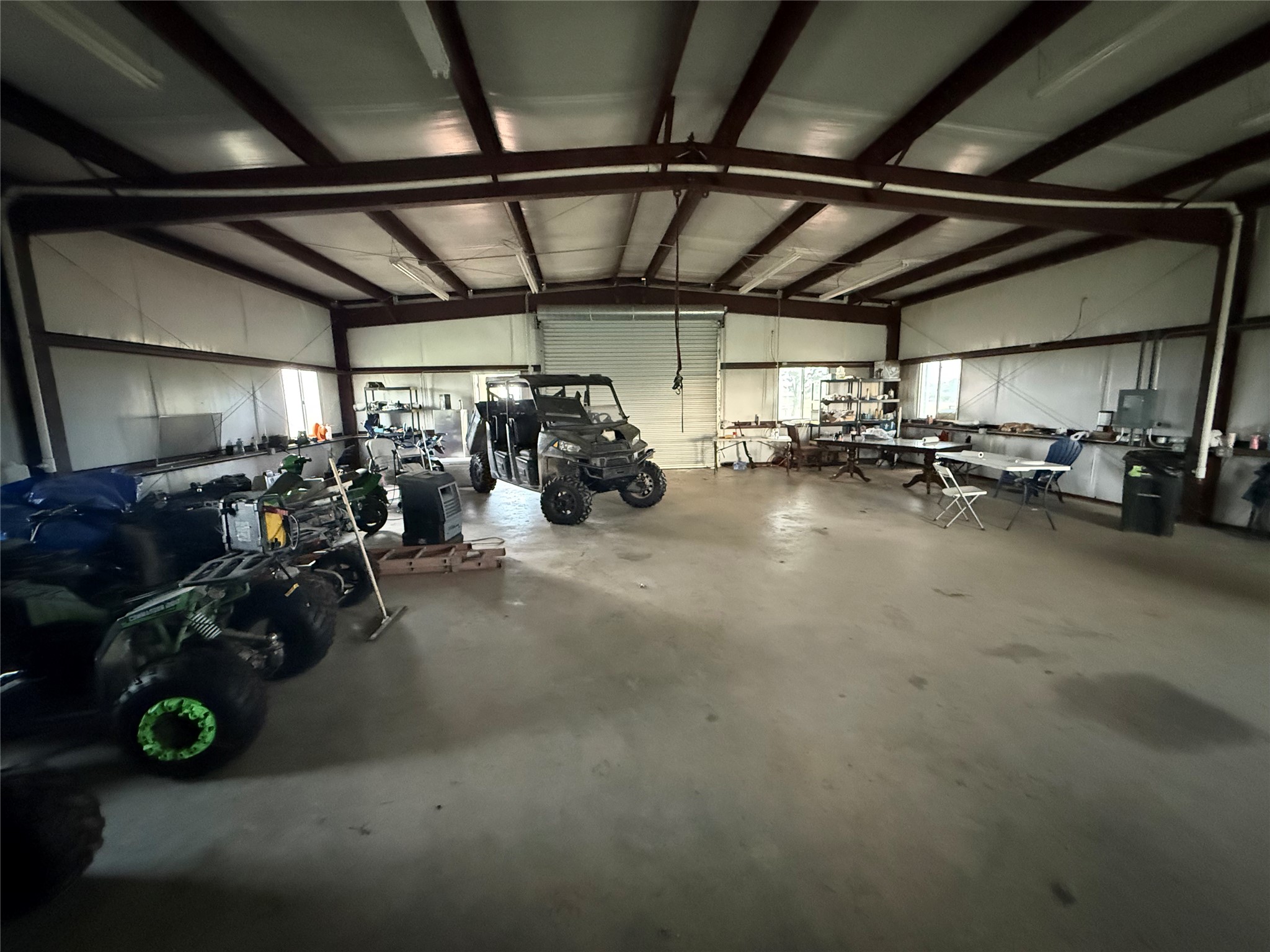 1240 Crooked Road Cat Spring, TX 78933 - Photo 10 of 20 a view of a garage with a bike and wooden roof