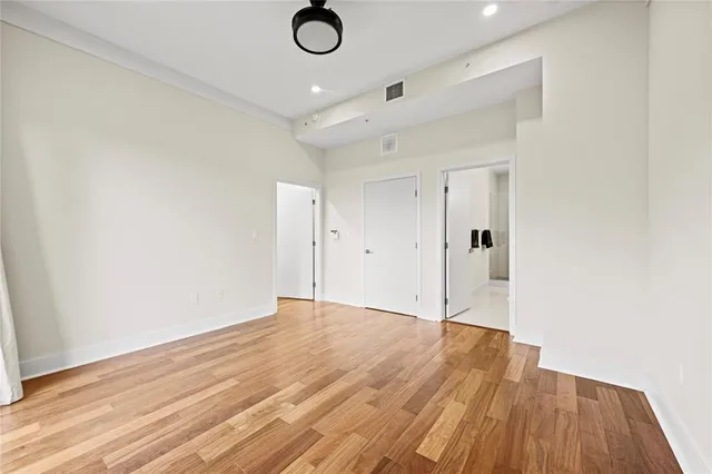 a bathroom with a granite countertop sink mirror vanity and toilet