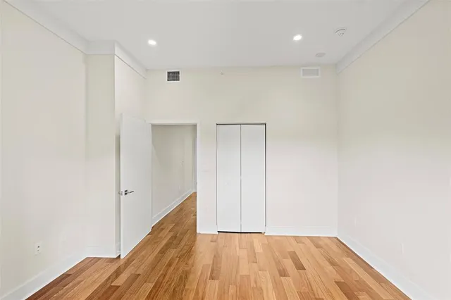 a bathroom with a sink a toilet a mirror and shower