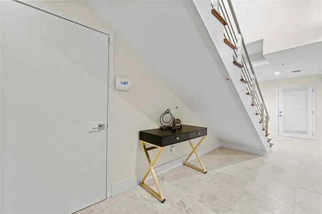 a view of an empty room with stairs