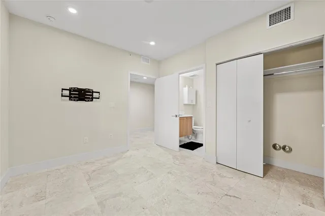 a bathroom with a shower and a sink