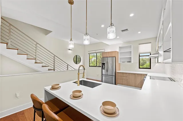 a kitchen with a table and chairs