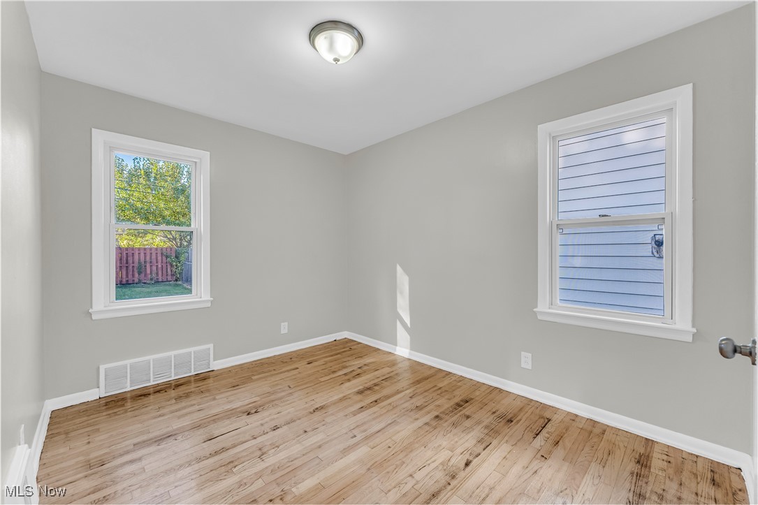 29034 Barjode Road Willowick, OH 44095 - Photo 9 of 24 Spare room featuring light wood-style flooring and baseboards