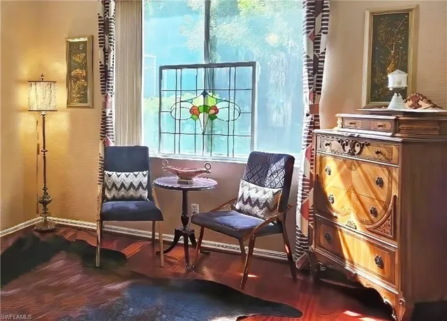 a living room with furniture and a window