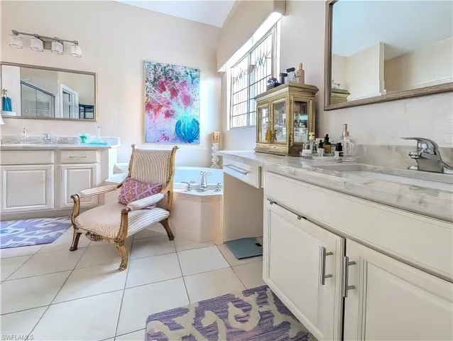 a very nice looking kitchen with granite countertop a sink and a stove