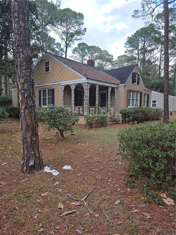 717 8th Avenue Albany, GA 31701 - Photo 2 of 25 a front view of a house with yard and trees