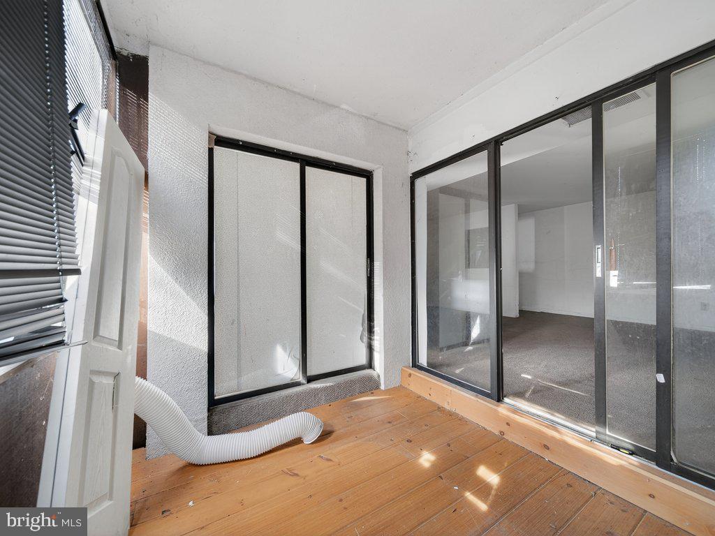 9635 White Acre Road, Unit B2 Columbia, MD 21045 - Photo 15 of 31 a view of an empty room with a fireplace