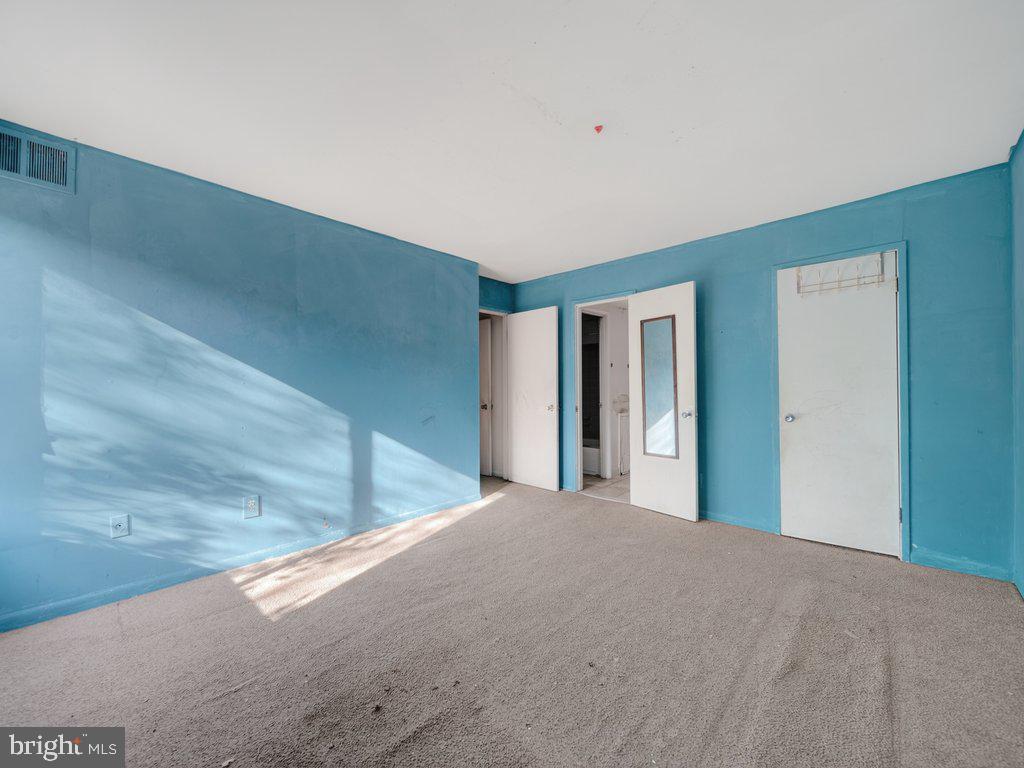 9635 White Acre Road, Unit B2 Columbia, MD 21045 - Photo 21 of 31 a view of a big room with closet and windows