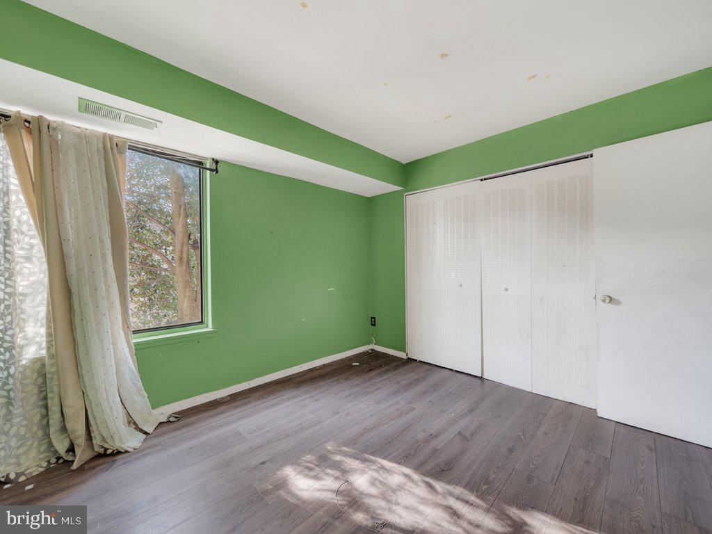 9635 White Acre Road, Unit B2 Columbia, MD 21045 - Photo 27 of 31 a view of room with window and hardwood floor