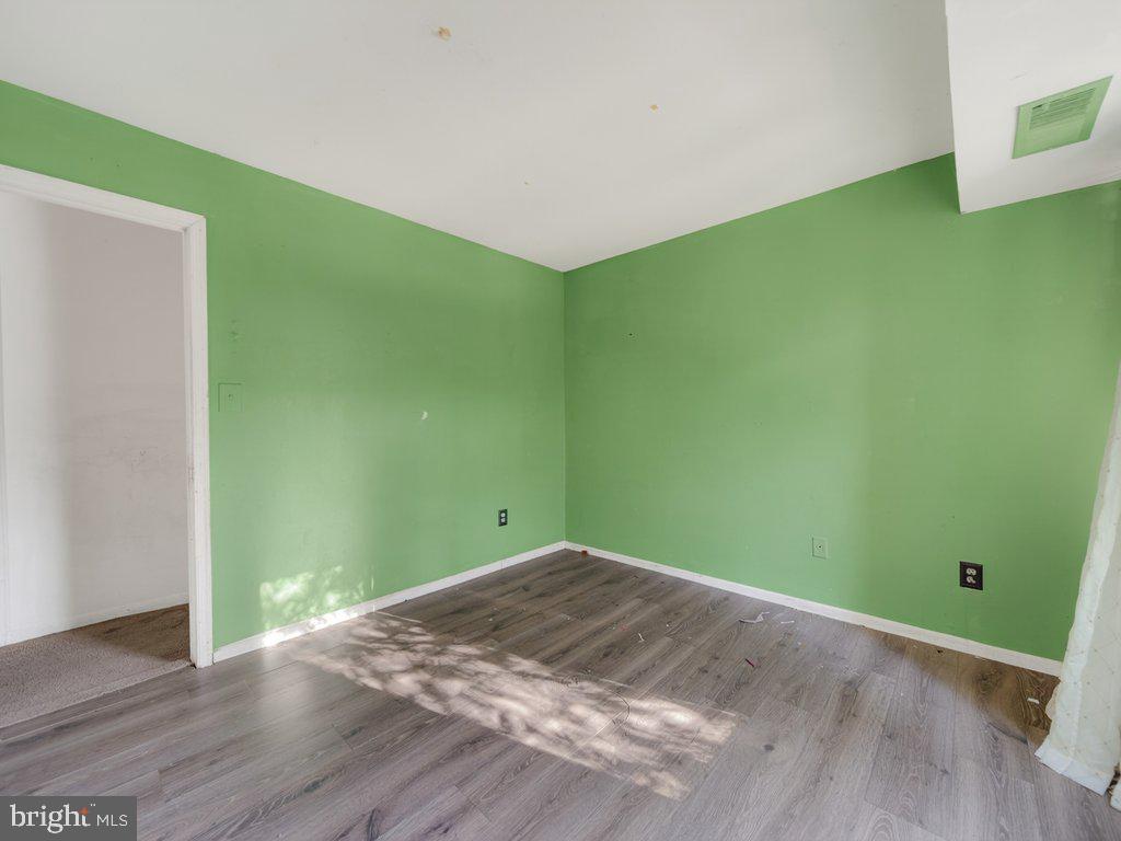 9635 White Acre Road, Unit B2 Columbia, MD 21045 - Photo 29 of 31 a view of empty room with wooden floor