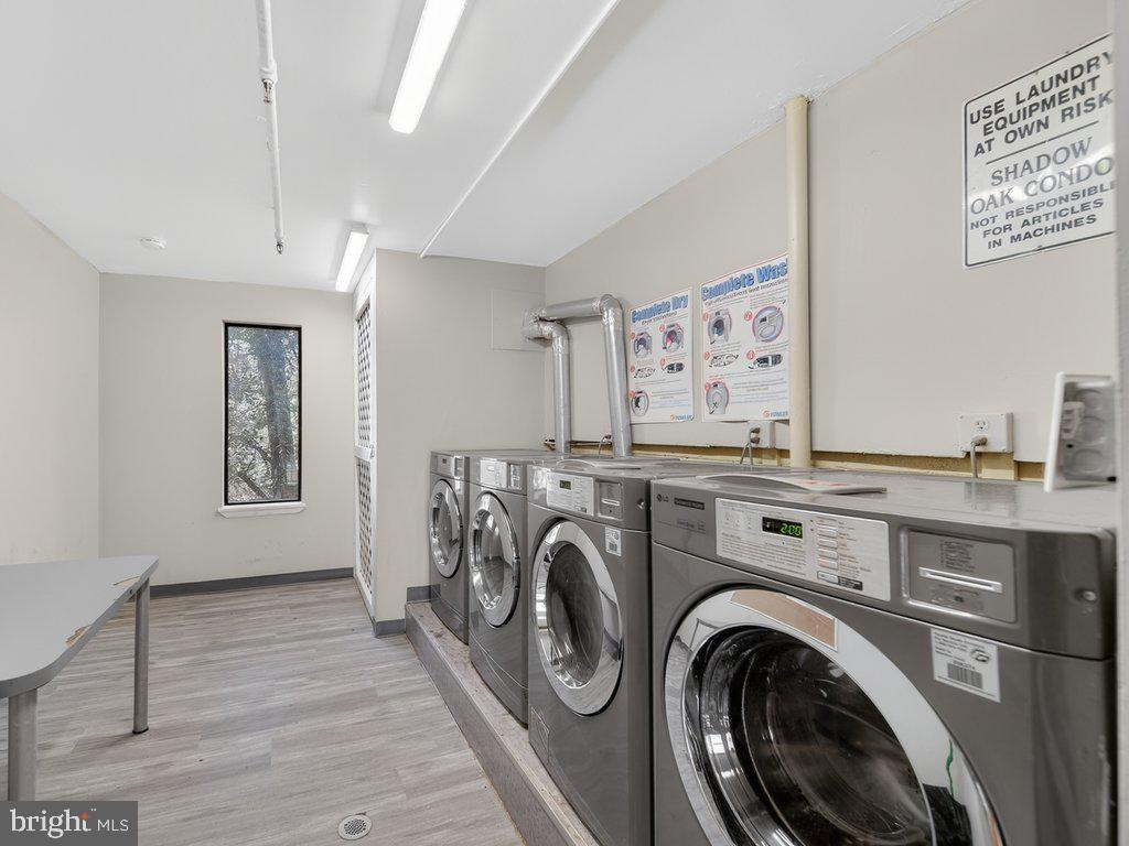 9635 White Acre Road, Unit B2 Columbia, MD 21045 - Photo 31 of 31 a view of a storage & utility room with washer and dryer