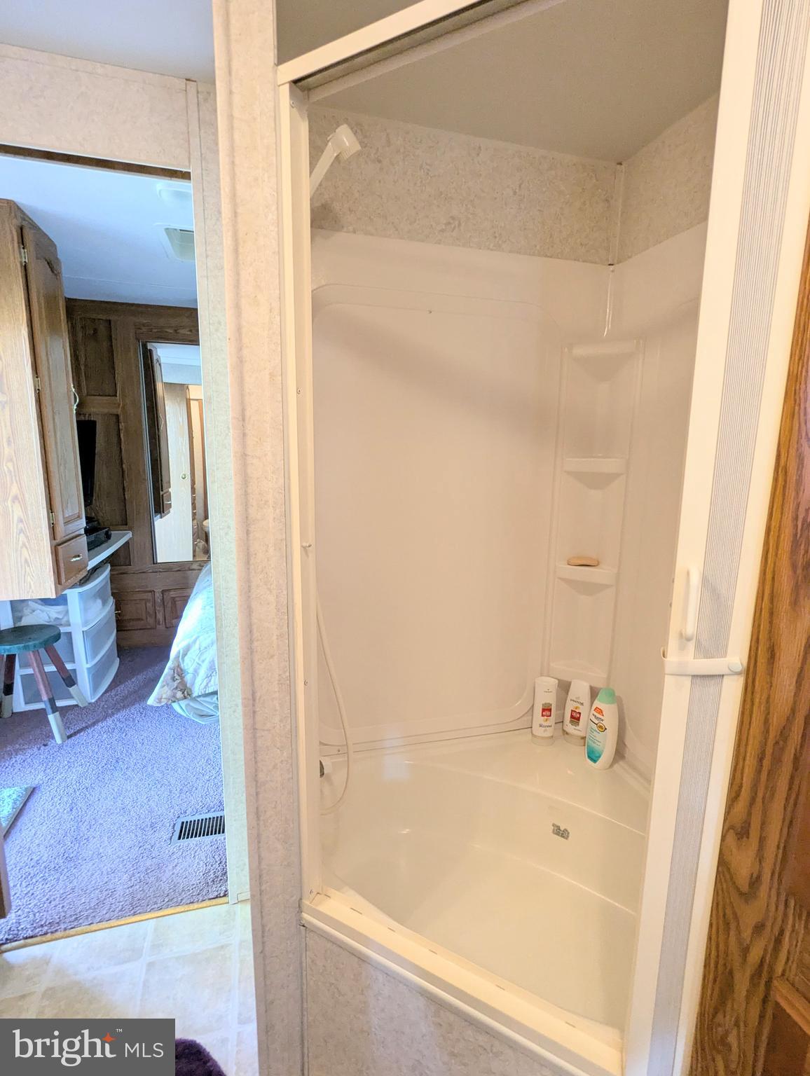 8 Avalanche Avenue Falling Waters, WV 25419 - Photo 12 of 13 a bathroom with a tub and shower