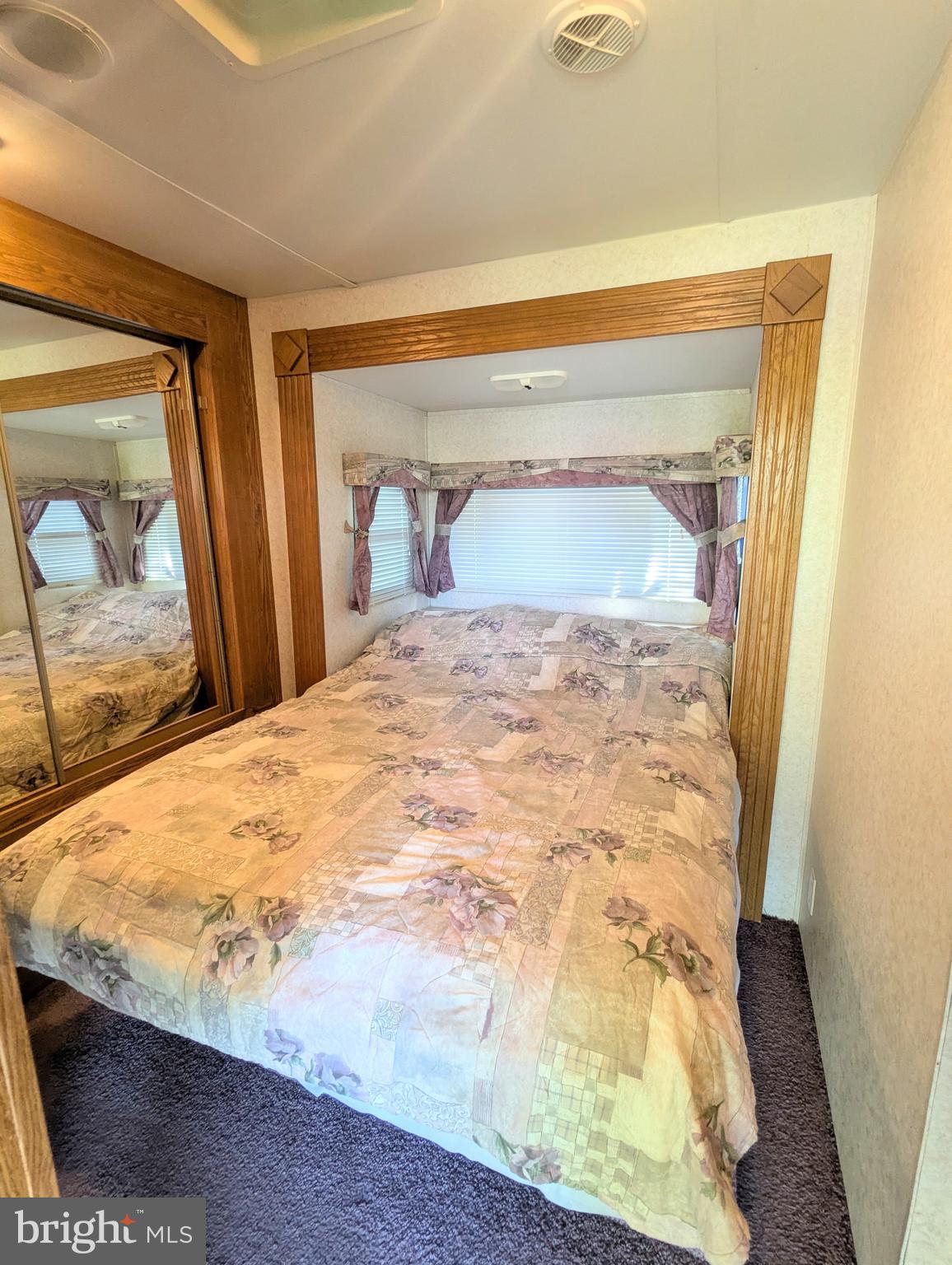 8 Avalanche Avenue Falling Waters, WV 25419 - Photo 13 of 13 a bed sitting in a bedroom next to a window
