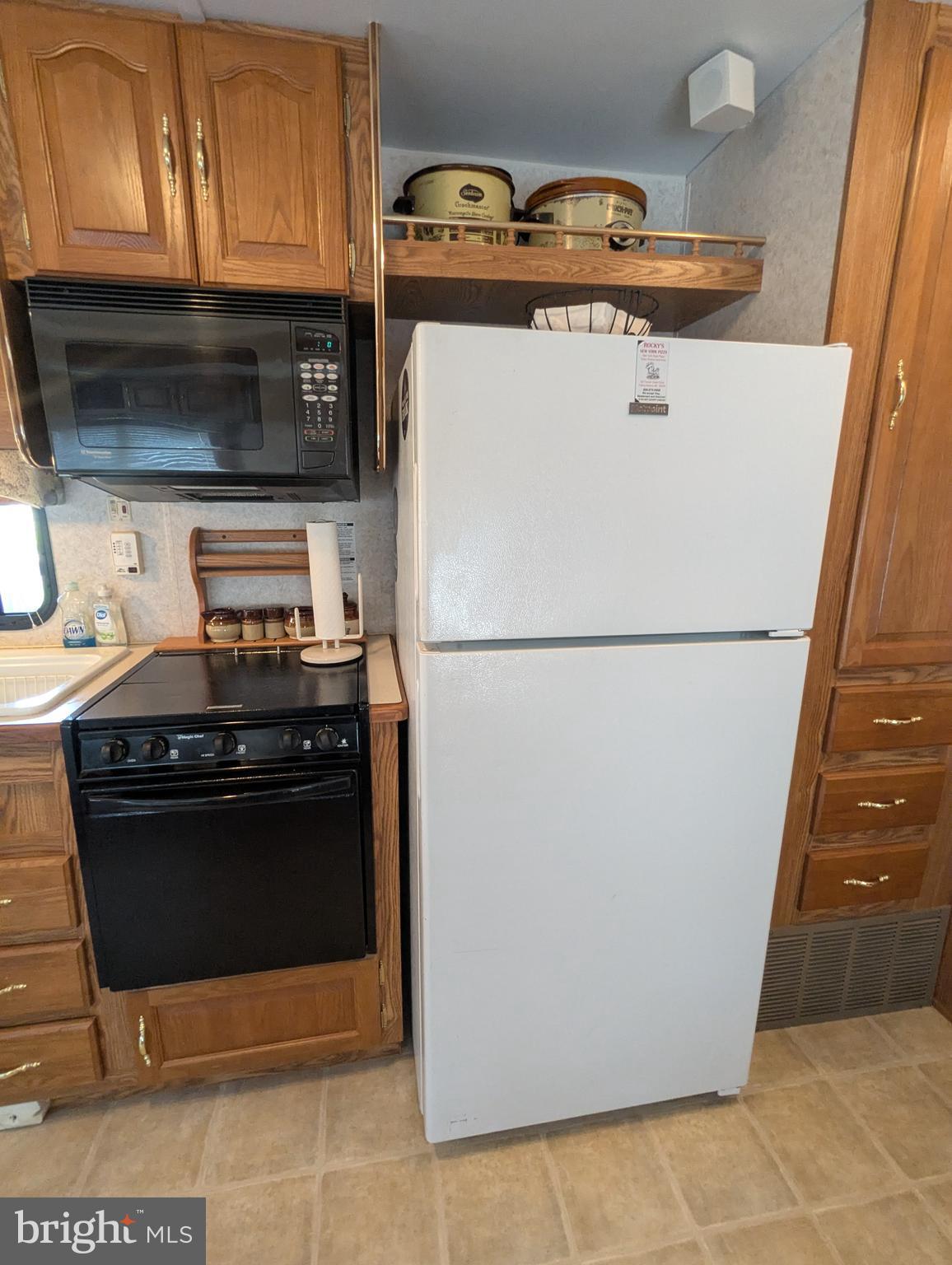 8 Avalanche Avenue Falling Waters, WV 25419 - Photo 5 of 13 a stove top oven sitting inside of a kitchen