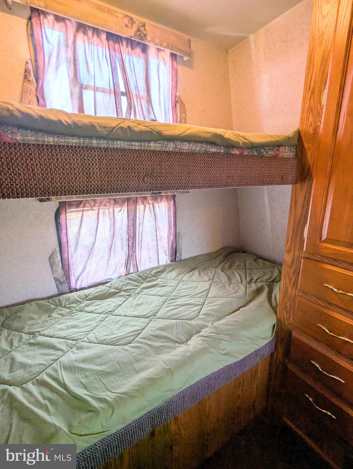 8 Avalanche Avenue Falling Waters, WV 25419 - Photo 9 of 13 a bedroom with a bed and a window